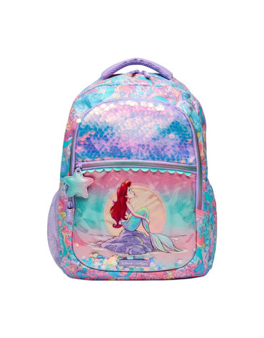 Front view of Smiggle Disney Princess Little Mermaid Classic Backpack showing Ariel sitting on a rock with a sunset background and shiny mermaid-scale panel.