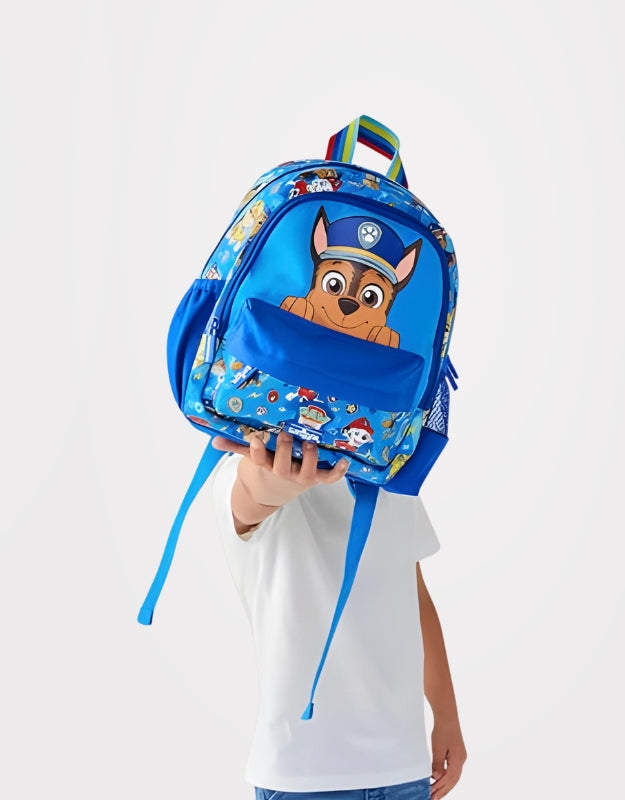 Child holding Smiggle Paw Patrol toddler backpack in blue with Chase character design.