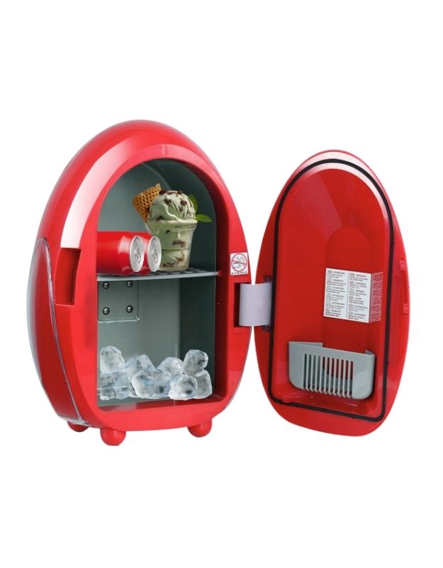 Red mini refrigerator with open door showing ice cubes and items inside on a white background. Red egg-shaped mini fridge with ice, drinks, and ice cream inside.