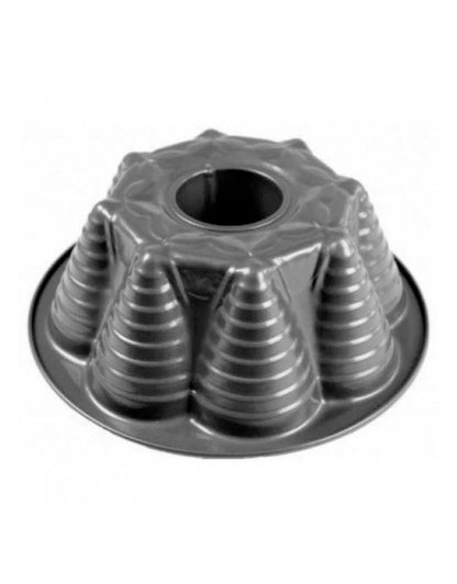 Metal bundt cake pan on a white background. Steel bundt cake pan with cone-shaped fluted pattern.