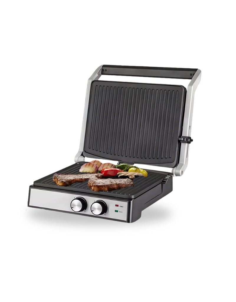 Super Crest 2000W contact grill cooking steak and vegetables on non-stick plates
