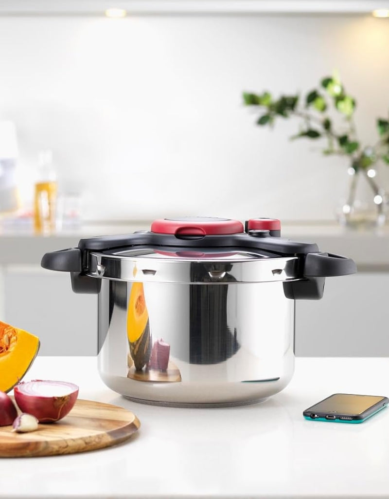 Tefal 9L stainless steel pressure cooker on kitchen counter – stylish design with fast cooking performance