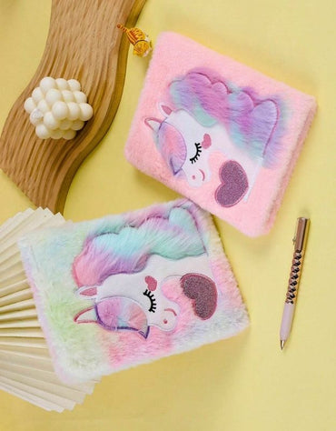 Two unicorn journals with colorful furry covers and heart pattern
