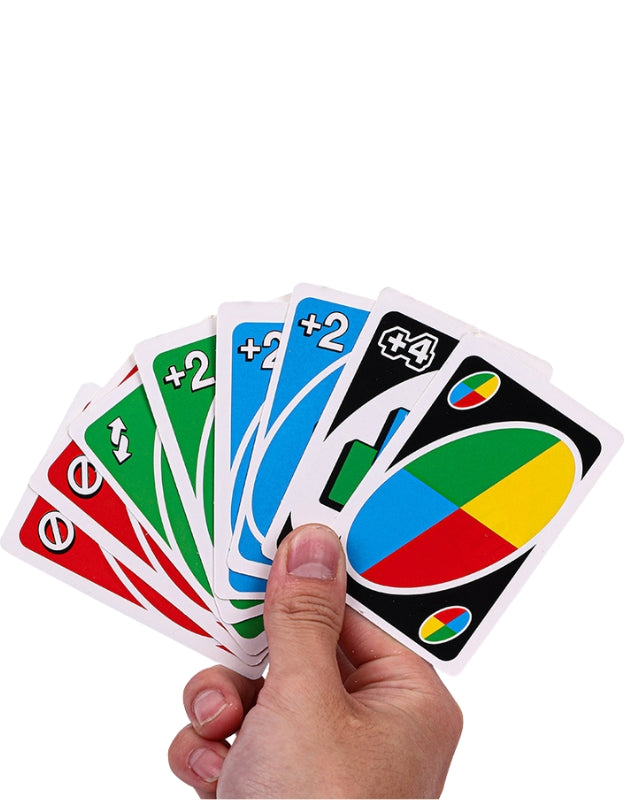 A hand holding a fanned-out set of UNO cards, showing a variety of colors and action cards like the +2 and the wild card