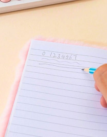 Hand writing numbers on a lined notebook with a pen.