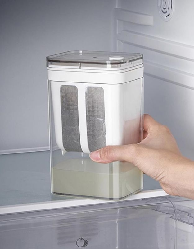 Greek yogurt strainer container placed in refrigerator.
