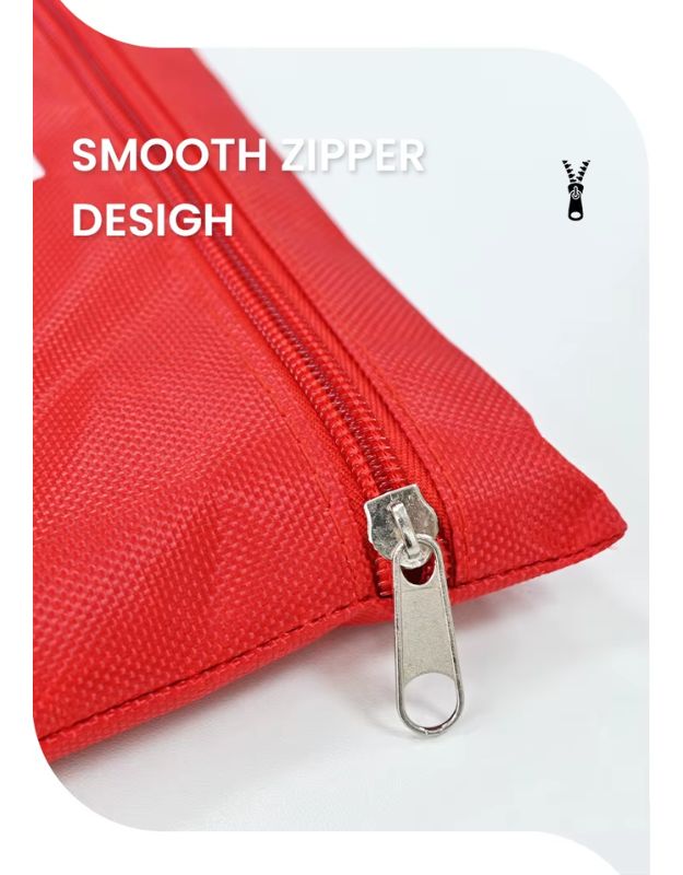 Close-up of smooth zipper on red emergency medical kit bag.